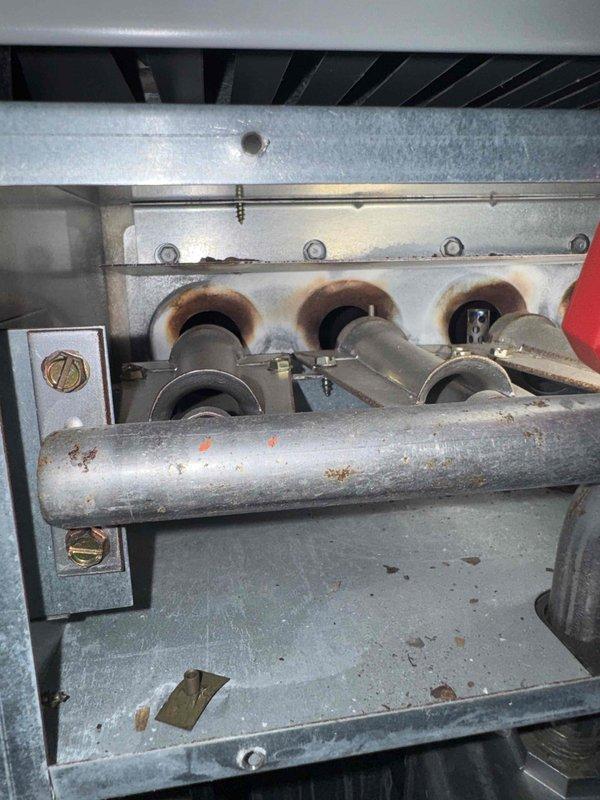 Diagnosed and repaired failed heat exchanger in furnace showing significant rust and corrosion around burner ports. Replaced primary heat exchanger assembly and verified proper operation of electrical components including pressure switch and wiring connections. System now functioning within manufacturer specifications with normal heat output.