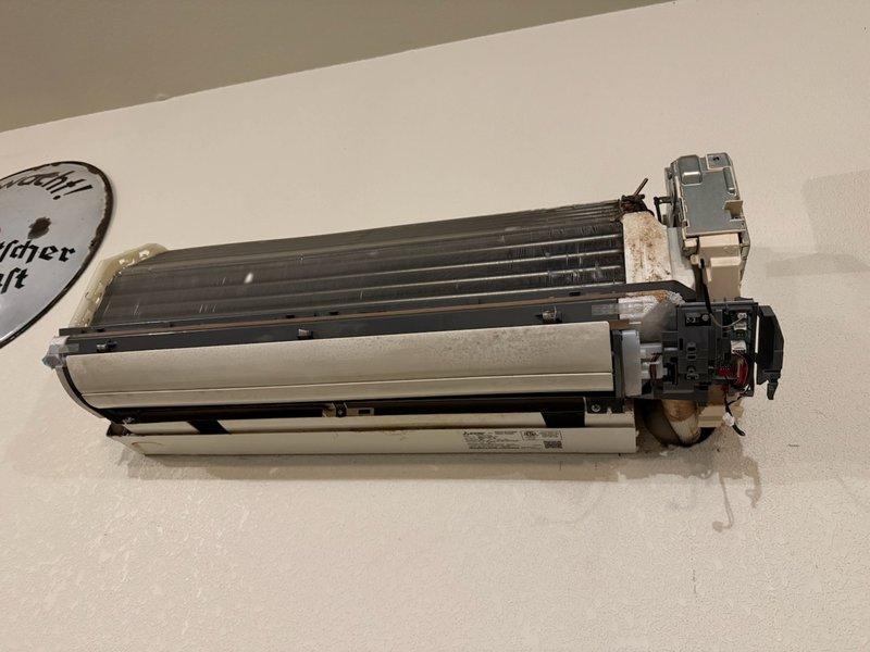 Responded to no-heat service call for system less than 10 years old. Diagnosed blower motor failure in air handler unit. Removed and replaced blower assembly after cleaning accumulated dust from fan coil unit and inspecting interior components. System restored to proper operation and heat function verified.