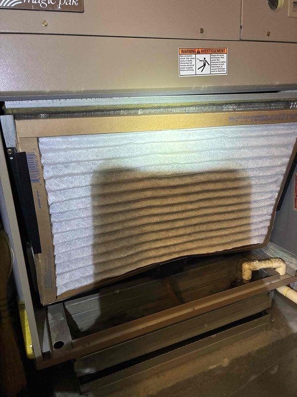 Performed standard tune-up on Magic Pak HVAC system including inspection and replacement of air filter. Noted structural concerns with concrete foundation near unit, specifically radiating cracks that may require monitoring. System is currently operational with no immediate performance issues detected.