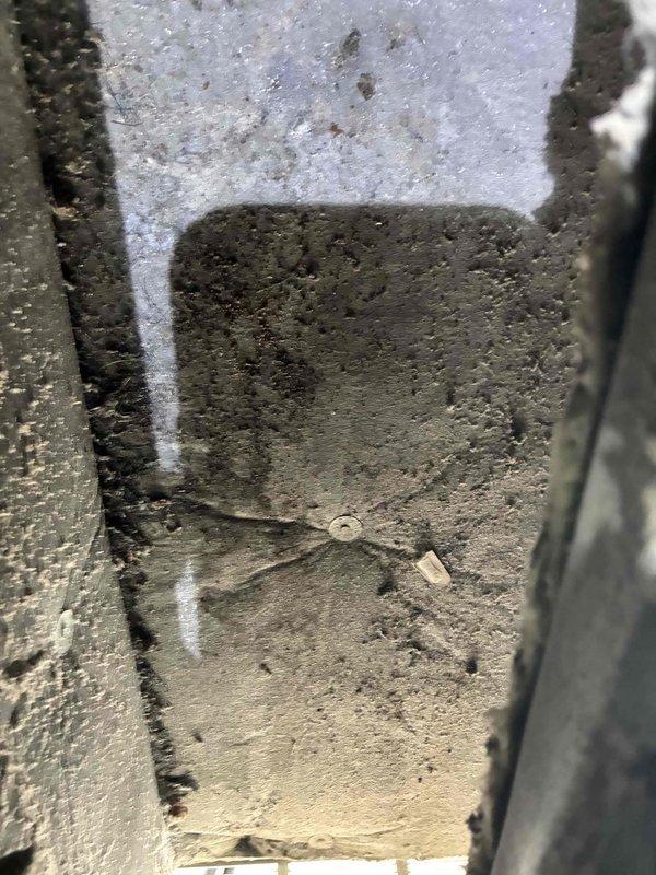 Performed standard tune-up on Magic Pak HVAC system including inspection and replacement of air filter. Noted structural concerns with concrete foundation near unit, specifically radiating cracks that may require monitoring. System is currently operational with no immediate performance issues detected.