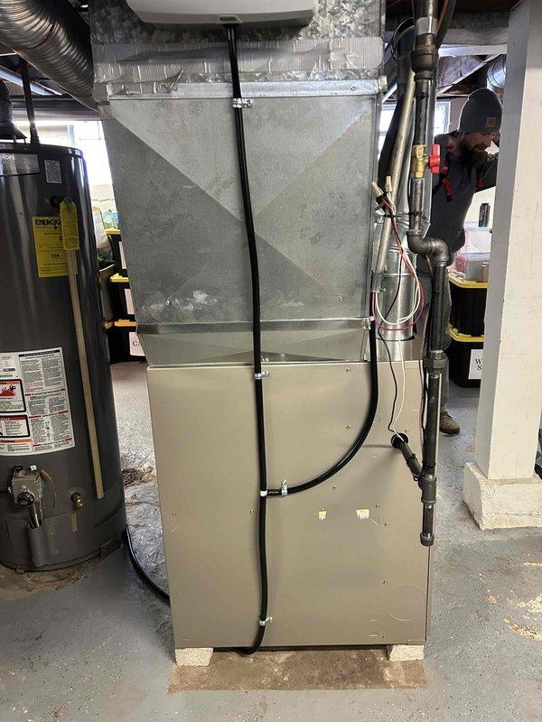 Successfully installed a new furnace unit with complete ductwork integration in the basement utility room. Connected all necessary condensate lines and verified proper alignment with existing water heater and mechanical systems. Final inspection confirmed system is operating according to manufacturer specifications.