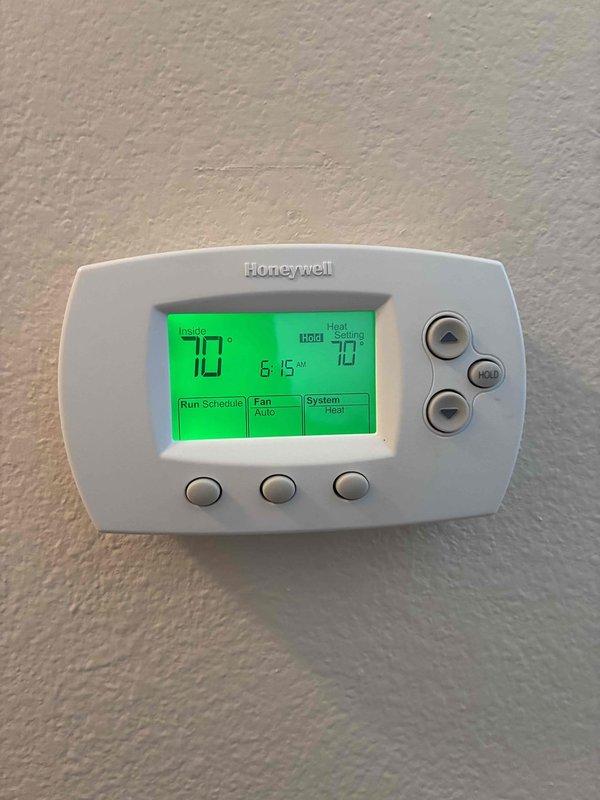 Responded to no heat complaint. Upon inspection, found thermostat displaying 55°F indoor temperature with 70°F set point. Confirmed heat call was active with "Heat On" indicator illuminated. Verified proper system operation as temperature was rising toward setpoint. No issues found with Honeywell ProSeries thermostat or heating system.