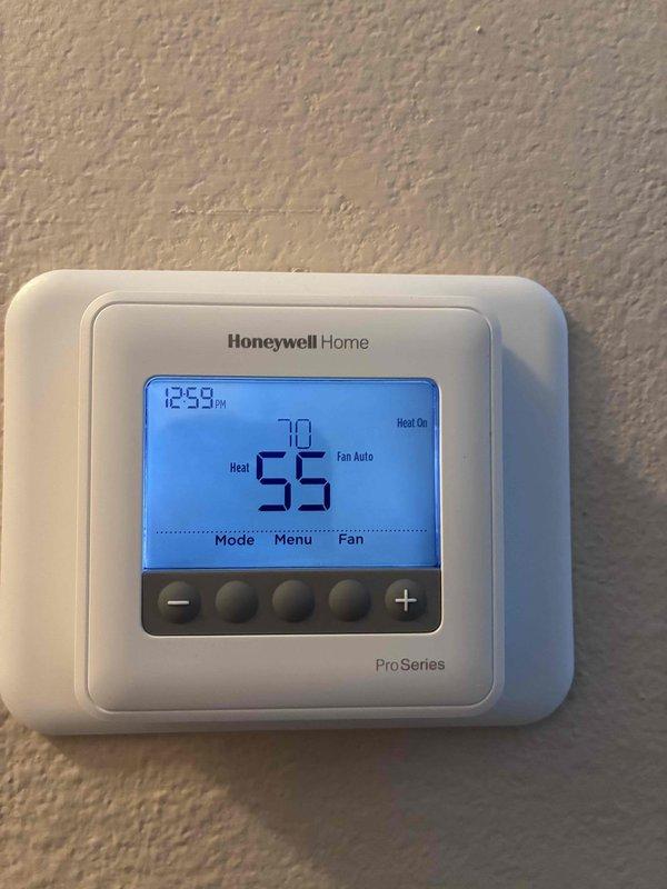 Responded to no heat complaint. Upon inspection, found thermostat displaying 55°F indoor temperature with 70°F set point. Confirmed heat call was active with "Heat On" indicator illuminated. Verified proper system operation as temperature was rising toward setpoint. No issues found with Honeywell ProSeries thermostat or heating system.
