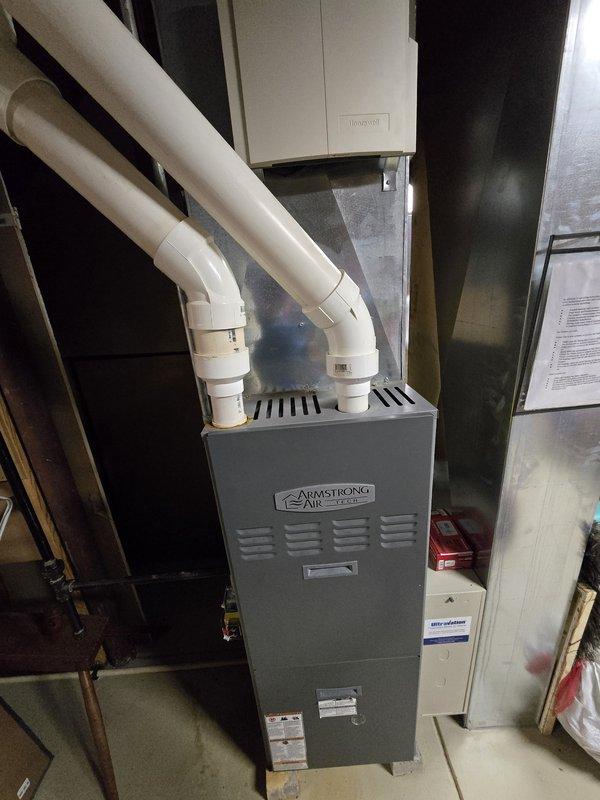 Performed preventative maintenance on Armstrong Air Tech furnace system. Inspected and cleaned all components including ventilation louvers, PVC exhaust/intake piping, and connected humidifier unit. System functioning properly with no issues detected.
