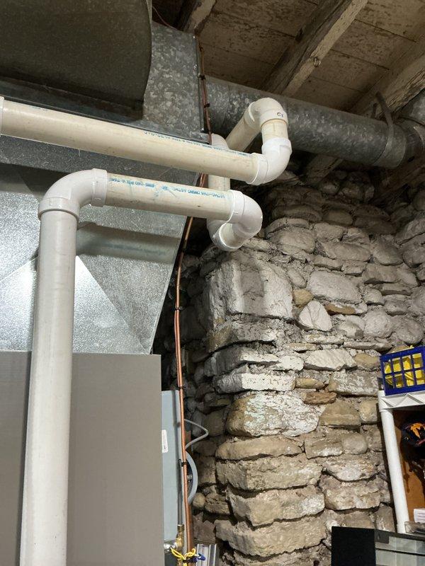 Completed routine HVAC maintenance agreement service on gas furnace system. Inspected internal components including motor assembly, wiring harnesses, and ventilation system. Verified proper operation of PVC drainage/ventilation pipes and examined ductwork integrity in basement installation.