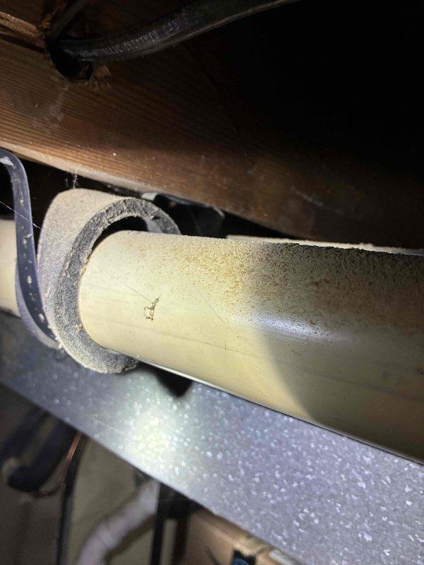 Conducted routine maintenance inspection on HVAC system with focus on PVC condensate line. Examined pipe installation and insulation collar integrity. Checked connection points and drainage functionality. System appears operational with no immediate concerns noted.