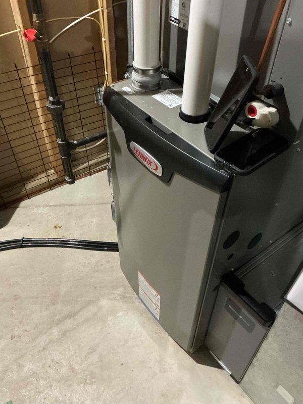 Performed routine maintenance on a Lennox HVAC system, including inspection of the furnace unit and associated ventilation components. Verified proper operation of intake and exhaust PVC pipes, checked all electrical connections, and confirmed system functionality according to manufacturer specifications.
