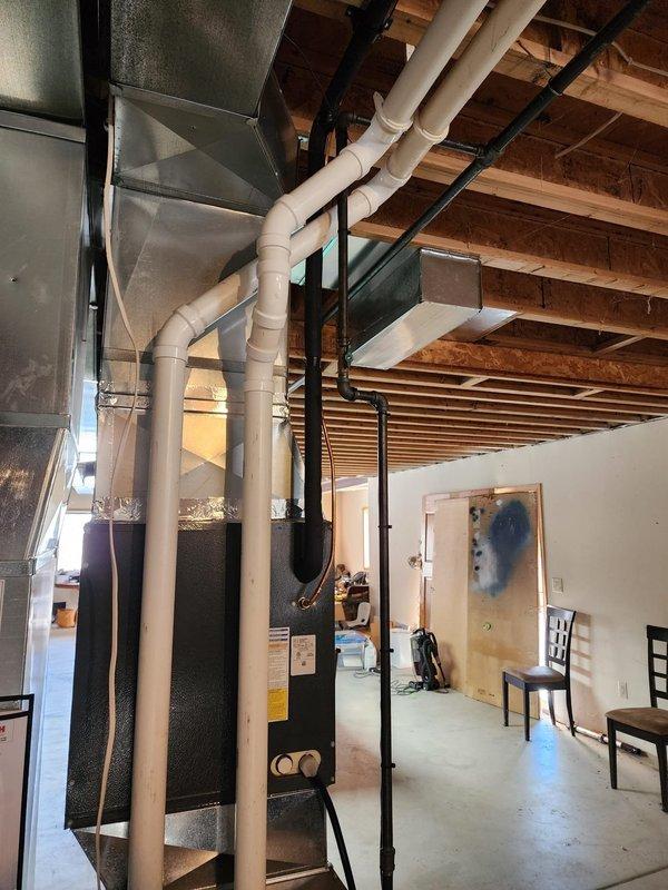 Successfully installed new furnace system in unfinished basement, including installation of metal ductwork, connection of PVC ventilation pipes, and proper integration with existing utility lines. System was tested for proper operation and all connections were verified secure prior to completion.