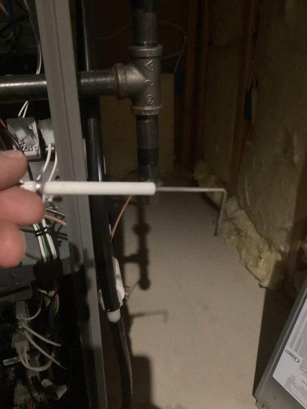 Performed routine tune-up service on Honeywell HVAC system, including inspection of control unit wiring connections and blower motor assembly. Checked circuit board and wire harnesses for proper function and examined plumbing components in the utility area, ensuring all connections were secure and operational.