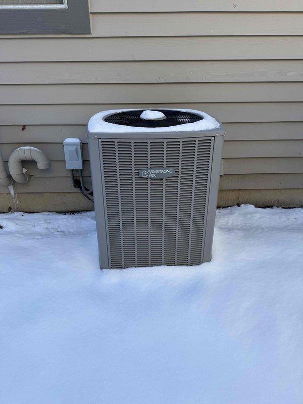 Conducted assessment of existing HVAC system including outdoor Armstrong air conditioning unit showing signs of frost/snow accumulation and aging components. Evaluated basement installation featuring current furnace with attached Aprilaire humidifier and associated ductwork. Prepared comprehensive replacement estimate for complete system upgrade to improve heating/cooling efficiency and resolve potential performance issues before system failure occurs.