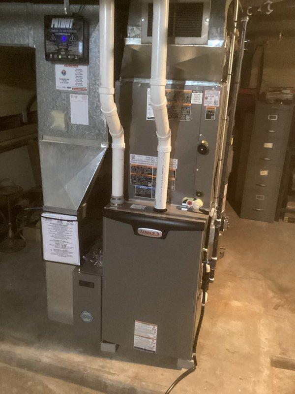 Successfully installed a complete Lennox HVAC system in the client's basement utility room. The installation included proper mounting of the furnace unit with appropriate PVC exhaust/intake ventilation, connection to existing ductwork, and verification of all system components for optimal performance.