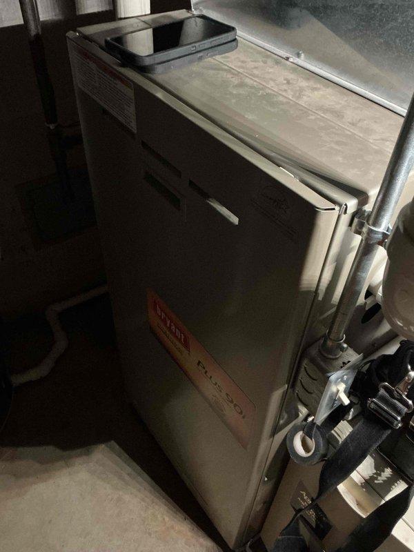 Responded to no heat call for aging Carrier Plus 90 furnace (10+ years old). Diagnosed refrigerant line freeze due to restricted airflow. Defrosted coil, cleaned condensate drain system, and replaced clogged air filter. System now operating within normal parameters with proper heating function restored. Recommended regular filter maintenance to prevent future issues.