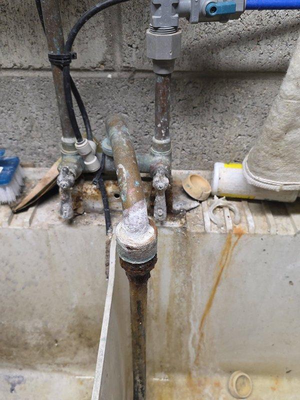 Replaced severely corroded copper supply lines to faucet fixture. Removed existing pipes showing significant oxidation and green patina, installed new copper piping with appropriate valves and connections, and applied proper sealing compound at joints. Tested system for leaks and proper water flow after installation.