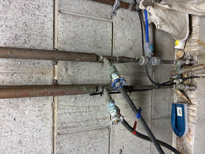 Replaced severely corroded copper supply lines to faucet fixture. Removed existing pipes showing significant oxidation and green patina, installed new copper piping with appropriate valves and connections, and applied proper sealing compound at joints. Tested system for leaks and proper water flow after installation.