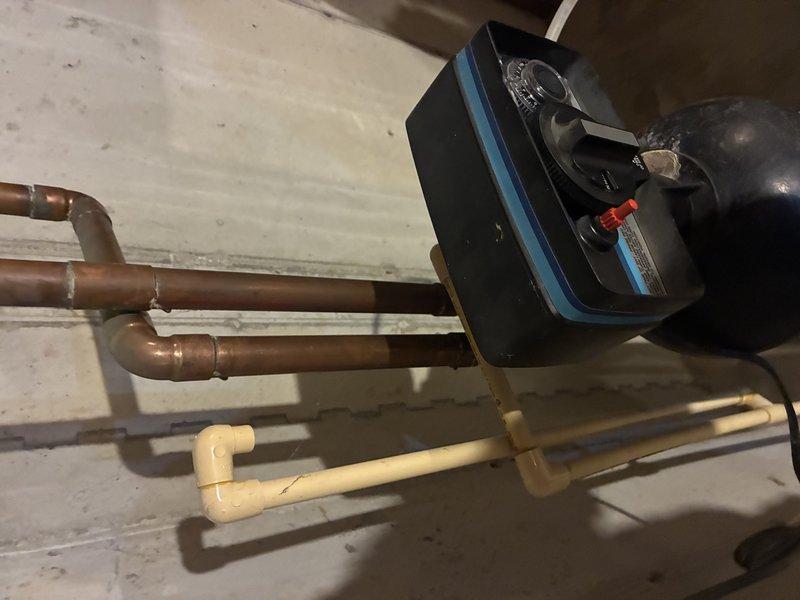 Installed pressure-balancing mixing valve with temperature control in copper supply line system. Connected valve to existing copper piping and integrated with PVC drainage components. Tested system for proper pressure regulation and temperature control functionality.