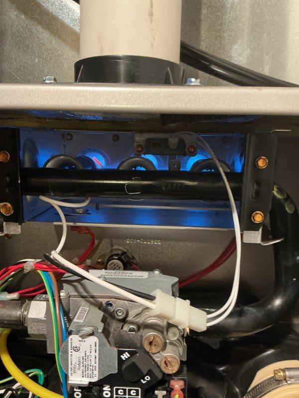 Performed comprehensive tune-up on residential gas furnace. Inspected burner assembly showing proper blue flame pattern and verified all electrical connections were secure. Examined heat exchanger, gas valve assembly, and draft inducer motor - all components functioning within normal parameters.