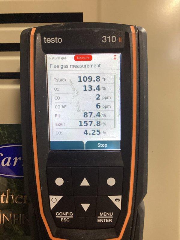 Performed routine tune-up on HVAC system including combustion analysis with Testo 310 II gas analyzer. Readings showed proper operation with 87.4% efficiency, acceptable CO levels (2 ppm), and normal stack temperature (109.8°F). Inspected interior components and wiring connections, making minor adjustments to ensure optimal performance.