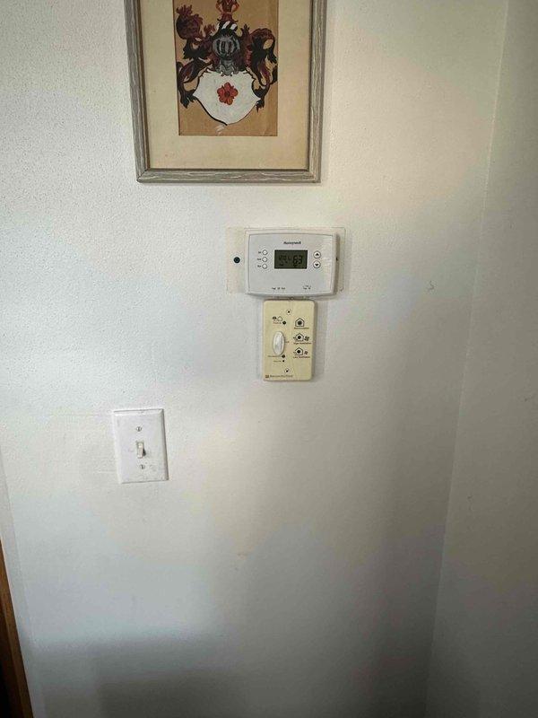 Conducted a comprehensive evaluation of the existing HVAC system including the outdoor air conditioning unit which showed signs of winter exposure and snow accumulation. Inspected the interior thermostat system (currently reading 62°F) and associated control panel for compatibility with potential replacement options. Provided detailed estimate for full system replacement to improve energy efficiency and heating/cooling performance.