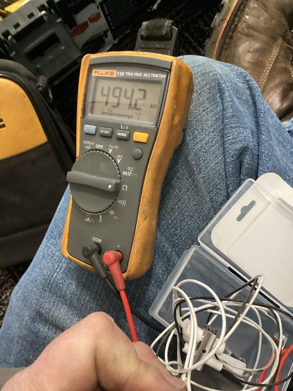 Responded to no-heat call on furnace less than 10 years old. Diagnosed failed ignition system with multimeter testing revealing 4.942V at control board. Replaced faulty igniter assembly and verified proper system operation with successful ignition and normal heating cycle.
