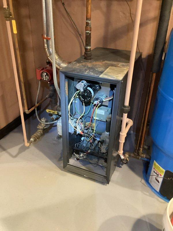 Responded to no heat call for unit less than 10 years old. Upon inspection, found failed blower motor preventing proper air circulation. Replaced motor assembly and verified all electrical connections (green, yellow, red, white wires) were properly secured. Tested system operation after repair, confirming proper ignition and airflow throughout the home. System now functioning normally with consistent heat production.