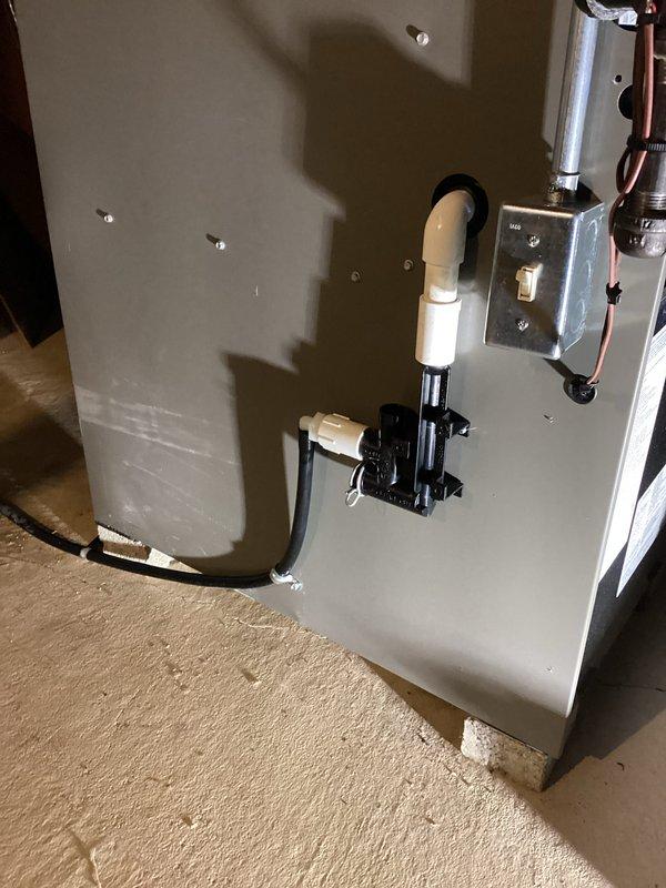 Successfully installed new furnace unit in basement area, including proper setup of condensate pump assembly with PVC drainage and connection of all electrical components. Verified system functionality with the newly installed Honeywell Home digital thermostat, confirming proper temperature display and operational controls.