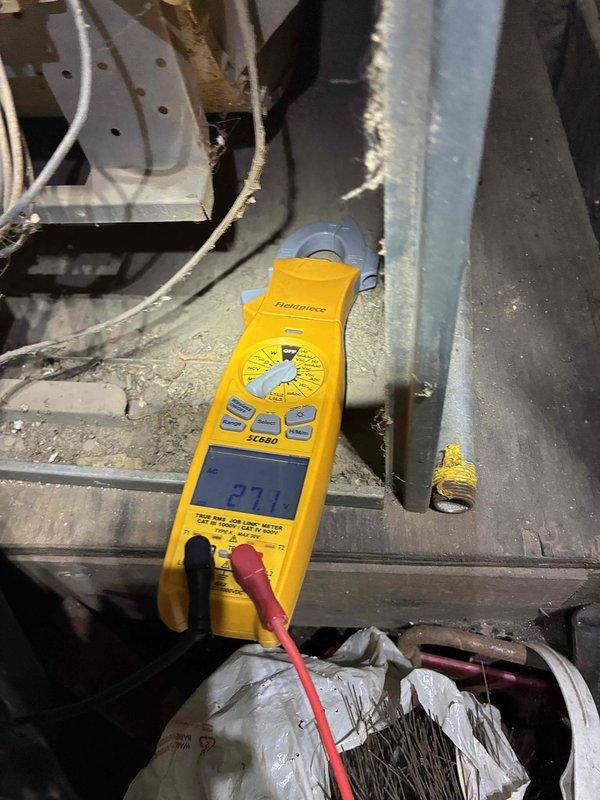 Performed diagnostic testing on aging furnace system showing no heat operation. Removed access panel to inspect internal components and identified faulty limit switch reading 27.1 ohms on multimeter. Replaced defective limit switch, cleaned accumulated dust from critical components, and verified proper ignition sequence. System now operating within manufacturer specifications with normal heat cycle.