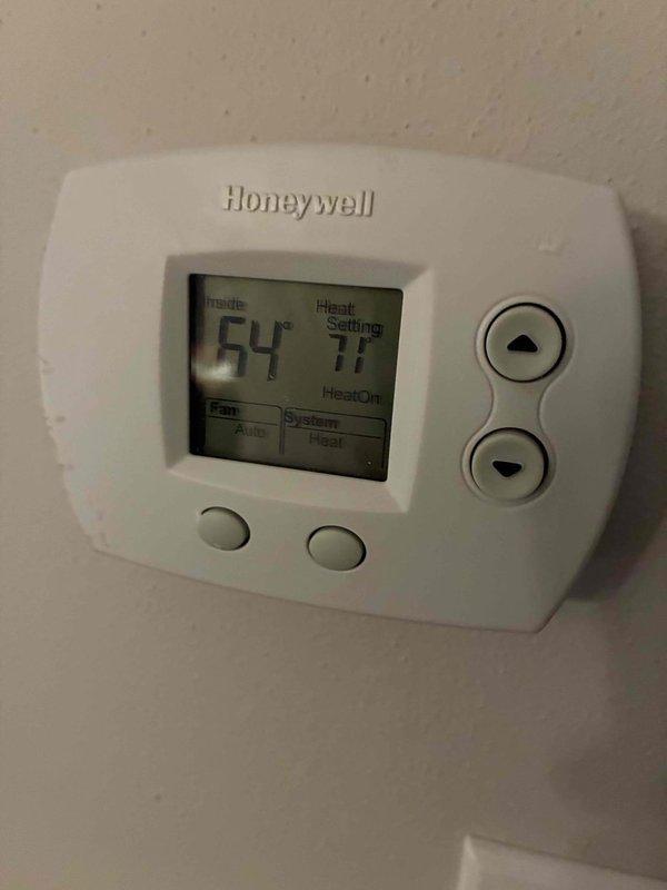 Responded to no heat call for residential system. Diagnosed issue with digital Honeywell thermostat showing 64°F indoor temperature despite 71°F heat setting. Verified furnace operation and ductwork integrity, confirming system was actively working to reach setpoint. Cleaned connections and confirmed proper thermostat function, restoring normal heating operation.