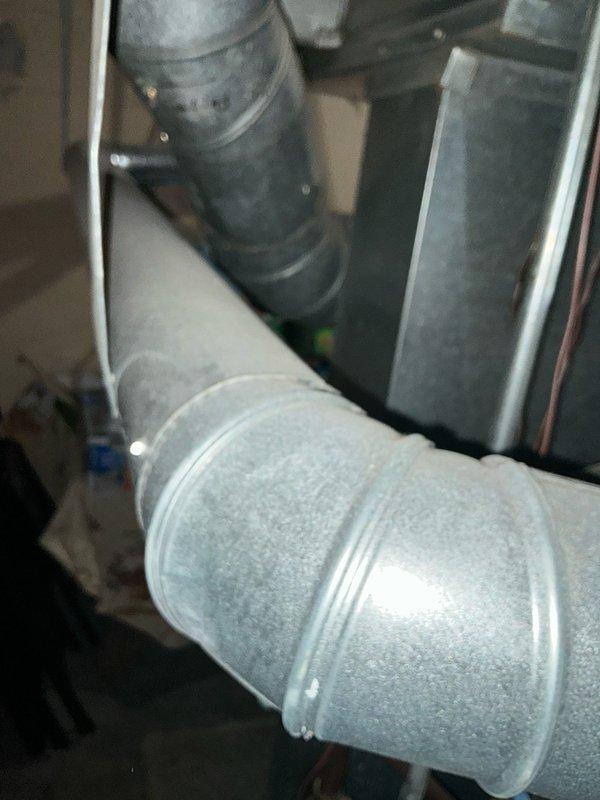 Conducted assessment of aging Trane XL 80 furnace system showing signs of moisture accumulation on top surface. Evaluated existing galvanized ductwork configuration including main trunk line, round connections and elbow joints. Prepared comprehensive replacement estimate for customer consideration.