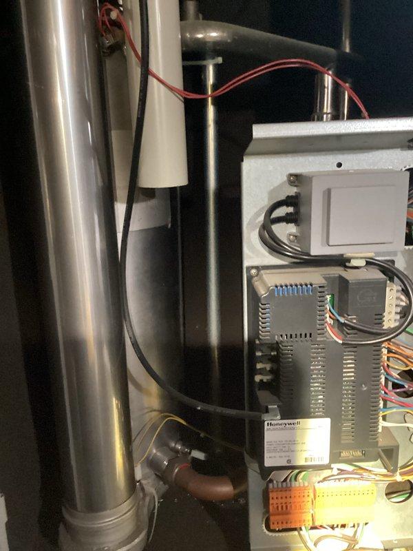 Performed diagnostic inspection on boiler system, checking pressure gauge readings and verifying proper operation. Examined control panel components including Honeywell controller and electrical connections. All systems operating within normal parameters with pressure readings in acceptable range.