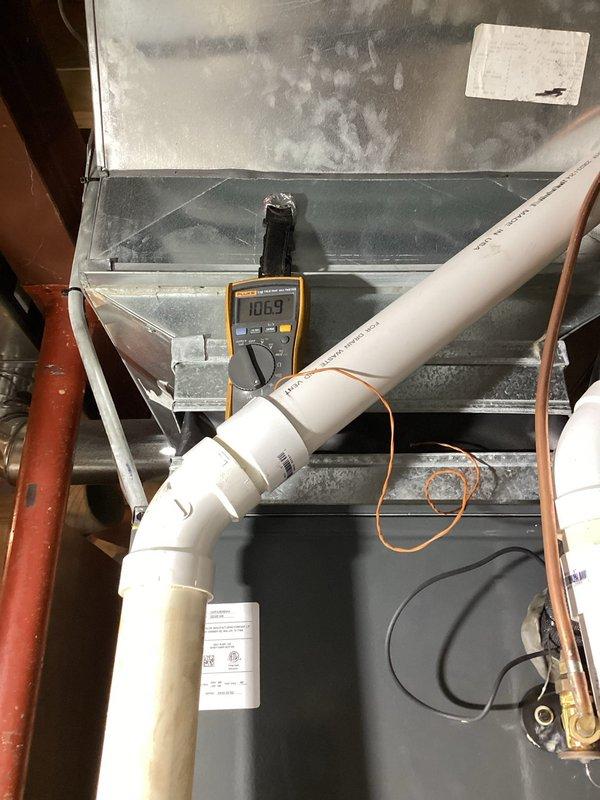 Responded to no heat call for Goodman HVAC system less than 10 years old. Diagnostics revealed induced draft motor failure with voltage reading of 10.69V (significantly below operational parameters). Replaced faulty motor, tested system operation through complete heating cycle, and verified proper combustion and exhaust venting through PVC flue pipe.