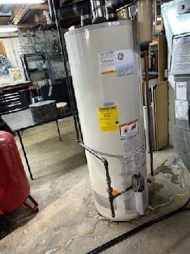 Performed routine maintenance on GE tanked water heater, including complete system flush to remove sediment buildup. Inspected all connections, valves, and pipes for proper function and potential leaks. Unit is operating efficiently with no issues detected.