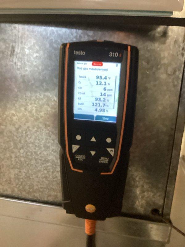 Performed scheduled maintenance on Honeywell furnace system. Conducted combustion analysis using Testo 310 gas analyzer, confirming proper operation with 93.2% efficiency, O2 at 95.4%, and CO at acceptable levels (6 ppm). Inspected burner assembly showing normal blue flame pattern and verified all electrical connections were secure.
