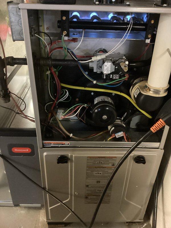 Performed scheduled maintenance on Honeywell furnace system. Conducted combustion analysis using Testo 310 gas analyzer, confirming proper operation with 93.2% efficiency, O2 at 95.4%, and CO at acceptable levels (6 ppm). Inspected burner assembly showing normal blue flame pattern and verified all electrical connections were secure.