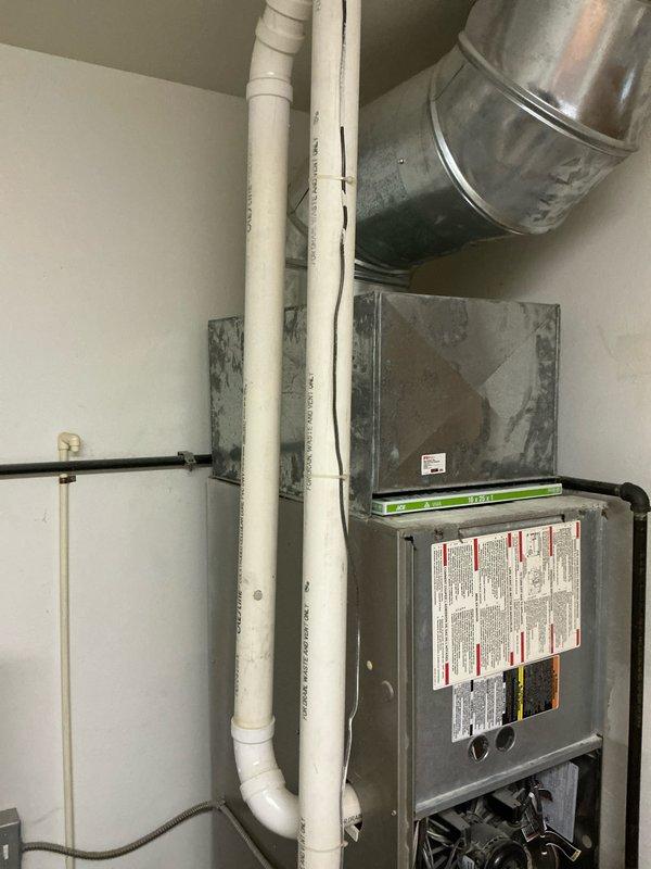 Completed replacement of existing HVAC system with new equipment including outdoor condenser unit installed on concrete pad and indoor furnace with proper ductwork connections. Installation included all necessary refrigerant lines, electrical connections, PVC venting, and condensate drainage to ensure full system functionality and compliance with manufacturer specifications.