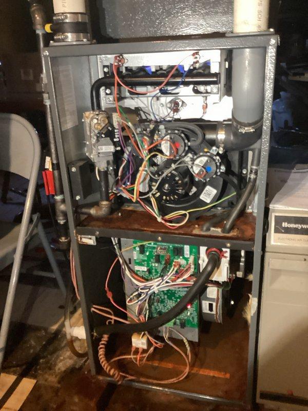Performed diagnostic inspection on customer's furnace system, revealing significant rust and corrosion on internal metal components. Identified and replaced faulty blower motor and associated wiring harnesses that were showing signs of deterioration. Cleaned corroded connections on circuit board and verified proper system operation after repair.