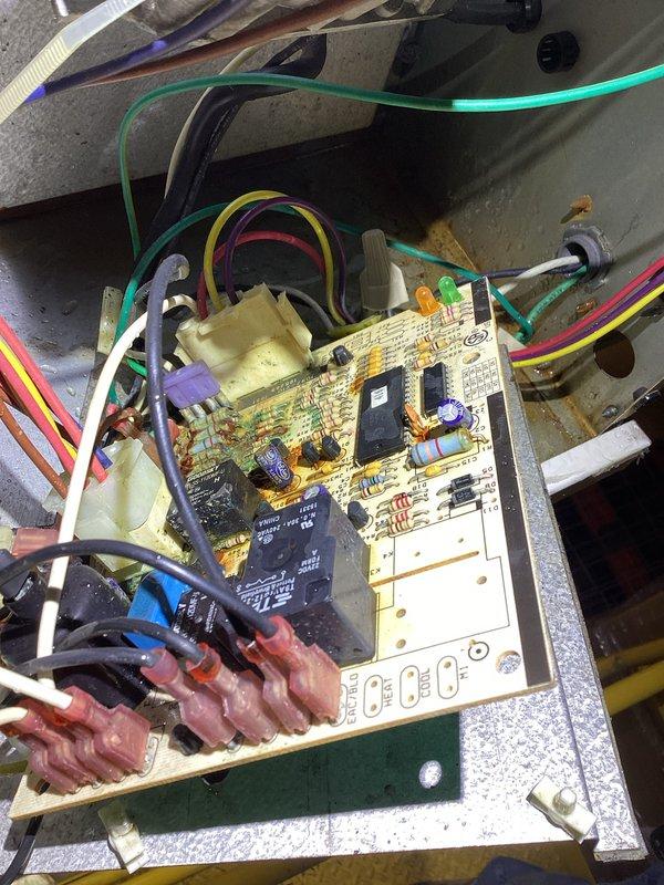 Completed replacement of defective control board on Reznor HVAC unit. Diagnosed electrical issues, installed new circuit board, and reconnected all wiring harnesses (green, yellow, red, white, black, and purple). System tested after installation with all functions operating normally.