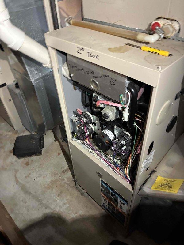 Performed diagnostic inspection on furnace system with front panel removed. Identified and repaired faulty electrical wiring connections, replacing damaged wire nuts and securing loose connections in junction box. System tested after repair and confirmed proper operation with normal cycling.