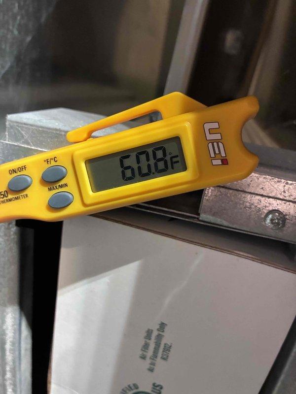 Performed routine HVAC maintenance service. Conducted diagnostic testing using Fieldpiece SC680 multimeter which showed reading of 63.48, and temperature measurements with UEI digital thermometer indicating 6.08°F. All system parameters verified within normal operating specifications.