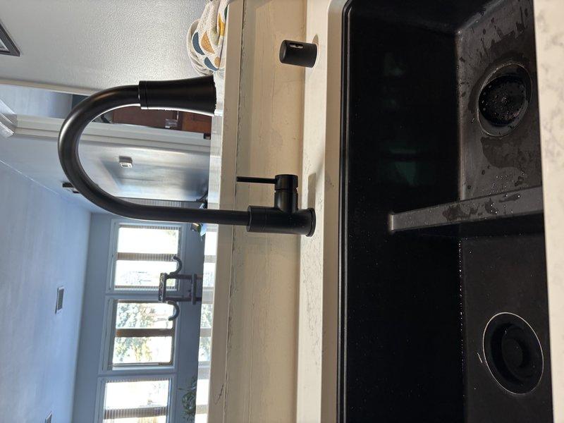 Completed installation of new kitchen faucet with proper connection to existing plumbing system. Installed and verified operation of garbage disposal unit, ensuring secure connections with PVC drainage pipes and P-trap assembly. All fixtures were tested for proper function and absence of leaks before completion.