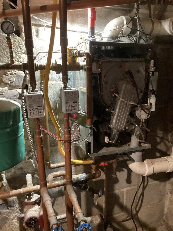 Diagnosed and repaired a no-heat condition on a residential boiler system less than 10 years old. Inspection revealed a faulty circulator pump and clogged condensate line causing system shutdown. Replaced circulator pump, cleaned condensate drain, and verified proper system operation with normal heating function restored.