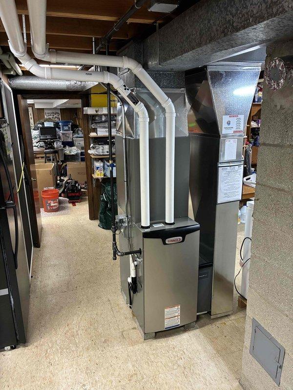 Successfully installed a complete Lennox heating system in client's basement utility room, including furnace unit with PVC ventilation pipes and comprehensive rectangular ductwork. System was properly connected to existing infrastructure with all manufacturer labels applied and safety protocols followed, providing an efficient, code-compliant HVAC solution.