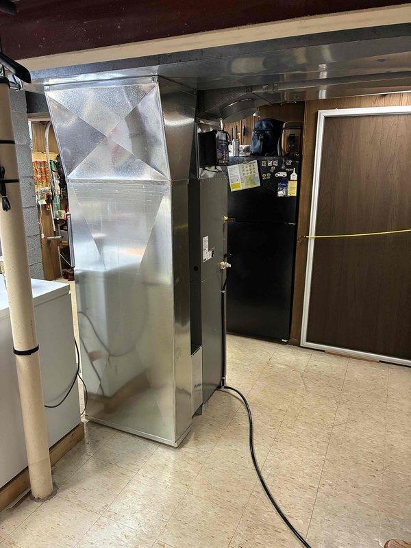 Successfully installed a complete Lennox heating system in client's basement utility room, including furnace unit with PVC ventilation pipes and comprehensive rectangular ductwork. System was properly connected to existing infrastructure with all manufacturer labels applied and safety protocols followed, providing an efficient, code-compliant HVAC solution.