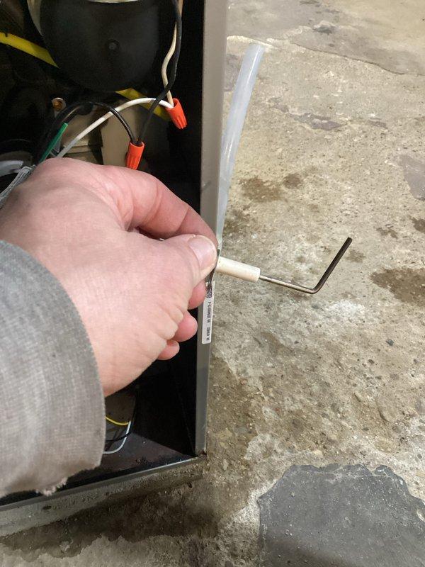 Performed routine tune-up maintenance on residential furnace system. Accessed internal components to inspect electrical connections and wiring integrity. Utilized hex key to adjust and secure mechanical components while verifying proper operation of the Honeywell control system. Checked blower motor assembly and confirmed all colored wiring connections were secure and properly terminated.