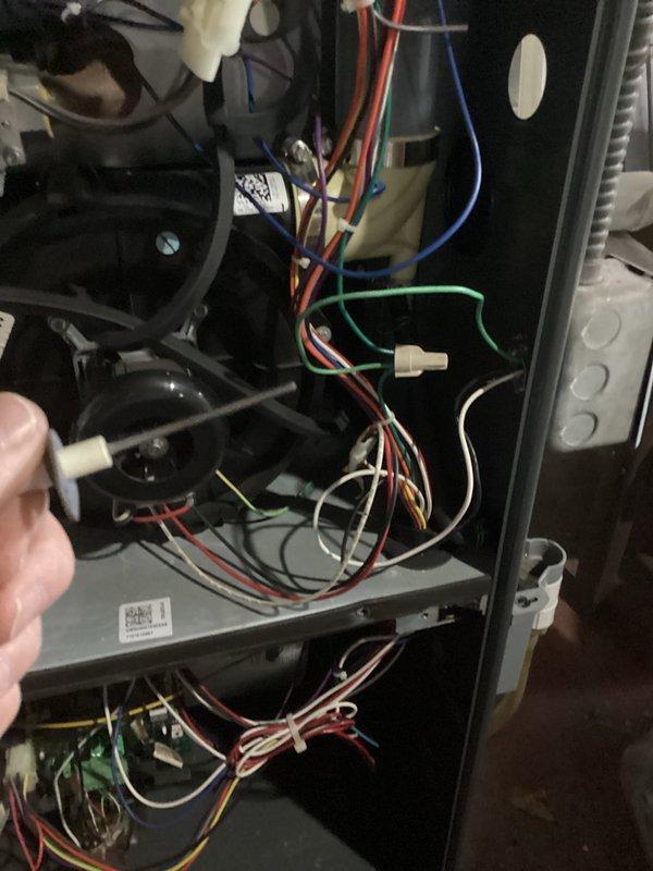 Performed comprehensive tune-up service on customer's gas furnace. Inspected and tested all electrical connections and wiring components, ensuring proper functionality of blower motor assembly and control board. Examined internal components with access panel removed to verify system integrity and operational status.