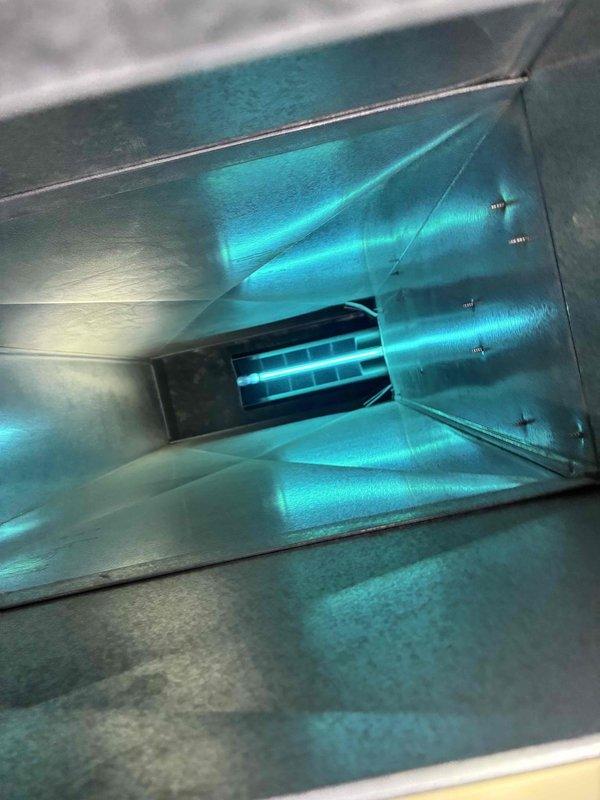 Performed scheduled prepaid maintenance on HVAC system. Inspected and cleaned ductwork, verifying proper UV light installation and functionality. Examined furnace burners, noting consistent blue flame pattern with one burner showing orange/red flame requiring adjustment for optimal combustion efficiency.