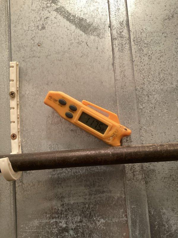 Performed comprehensive tune-up service on the air handler unit, inspecting the evaporator coil and copper refrigerant lines which were found to be in good condition with no signs of corrosion or leakage. Temperature measurements indicated proper system operation with supply air temperature at 116.5°F, confirming the heating cycle is functioning within normal parameters. All connections were verified secure and the system is operating efficiently.