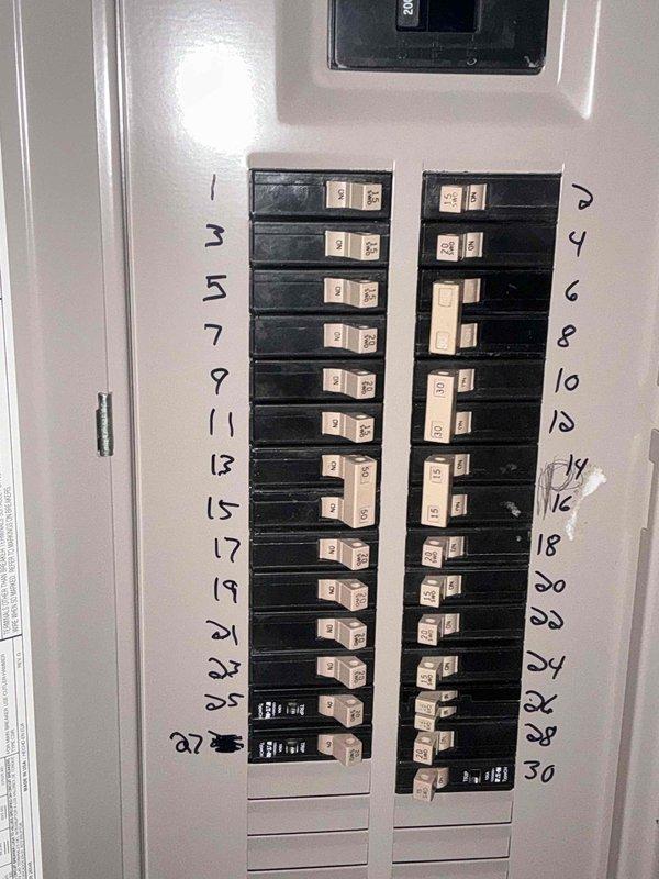 Conducted an electrical inspection of the circuit breaker panel to evaluate capacity for new HVAC system installation. Panel shows proper labeling with sufficient available circuits. Assessed basement utility area with exposed ceiling joists and plumbing configuration to determine optimal routing for new system components.