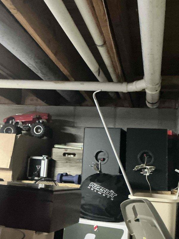 Conducted an electrical inspection of the circuit breaker panel to evaluate capacity for new HVAC system installation. Panel shows proper labeling with sufficient available circuits. Assessed basement utility area with exposed ceiling joists and plumbing configuration to determine optimal routing for new system components.