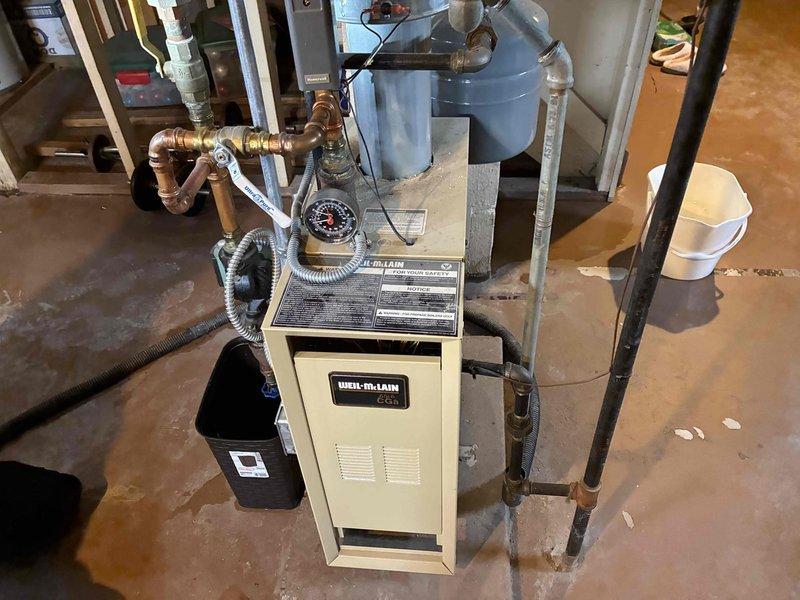 Performed comprehensive inspection of Weil-McLain boiler system. Checked all copper piping connections, valves, and pressure gauges for proper operation and signs of leakage. Verified expansion tank pressure and confirmed proper venting of the system. All components found to be functioning correctly with no immediate issues requiring repair.