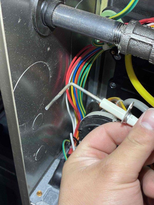 Performed comprehensive HVAC tune-up service including electrical system diagnostics with SC680 clamp meter, recording amperage readings of 0.45. Completed inspection and reconnection of control wiring at the electrical panel, ensuring proper terminal connections for all control circuits (red, yellow, green, blue, and white wires).